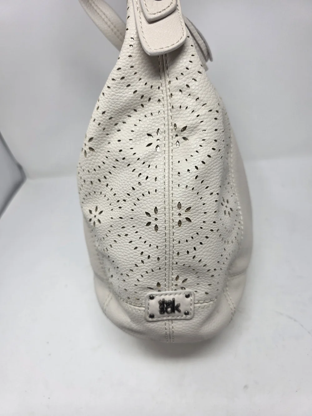 ​The Sak Off White Pebbled Leather Hobo Bag Perforated Cutout Tassel